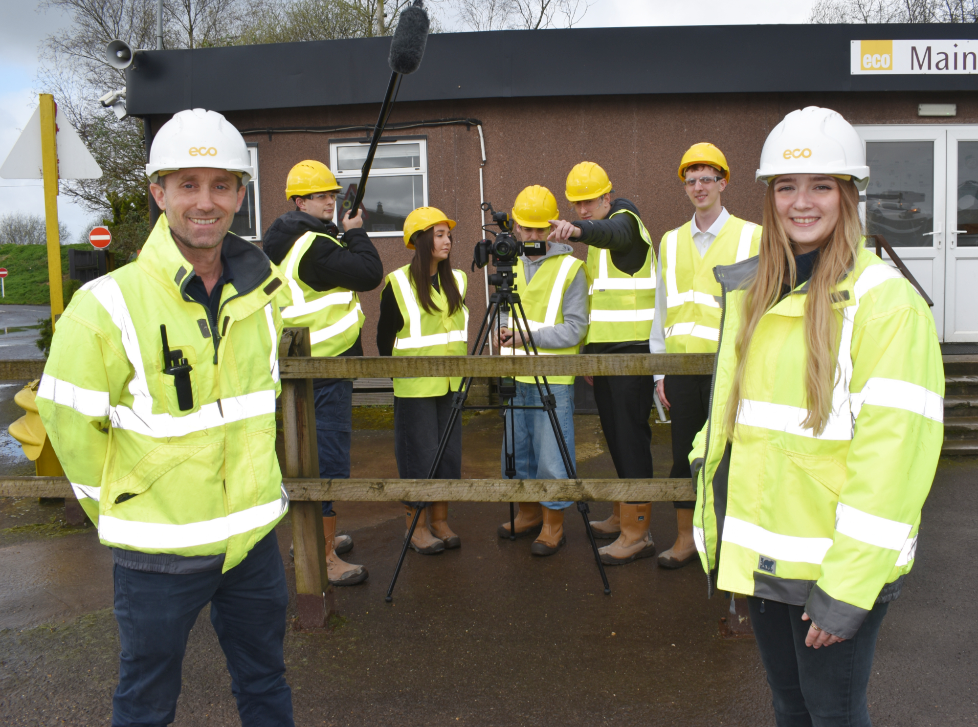 Students and team members stood at Eco site filming